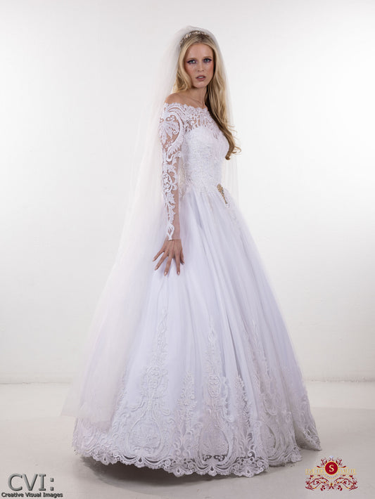 White lace couture wedding dress long sleeve on a white background on woman with long blonde hair standing sideways